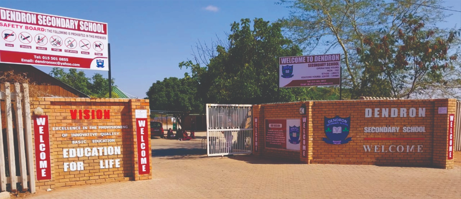 Dendron Secondary School entrance branding with vision wall, welcome panels and safety board